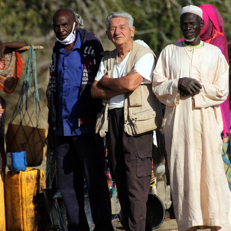 A missionary Jesuit with two African men